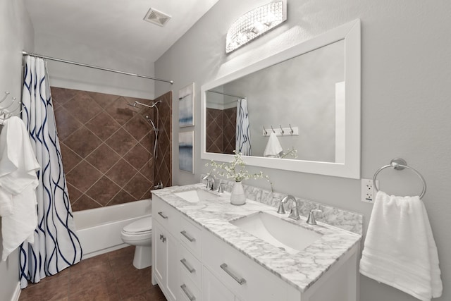 full bathroom featuring toilet, vanity, and shower / bath combination with curtain