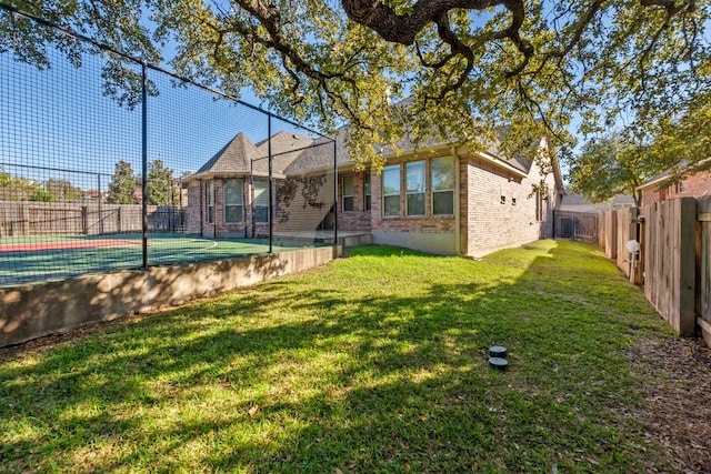 rear view of house with a yard