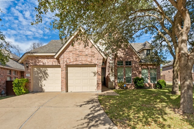 view of front facade with a front lawn and a garage