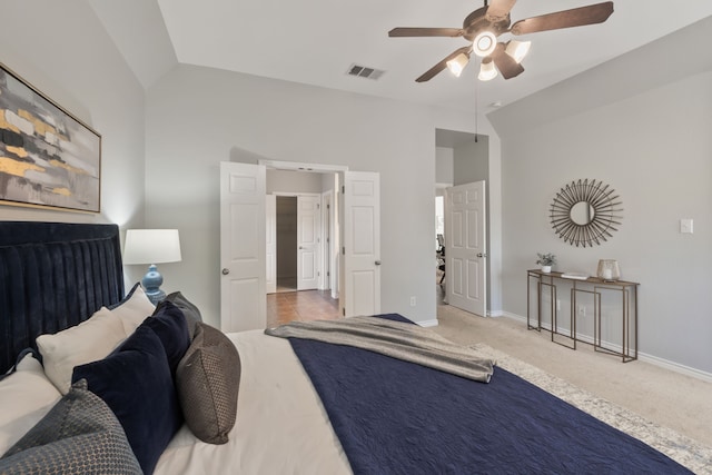 bedroom featuring ceiling fan, carpet, and vaulted ceiling