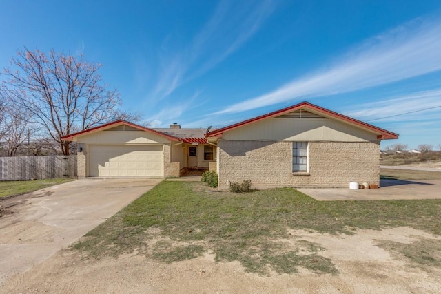 ranch-style house with a garage and a front lawn