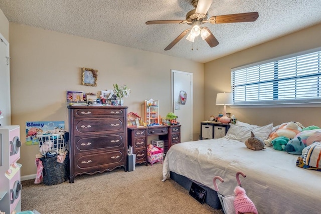 carpeted bedroom with ceiling fan and a textured ceiling