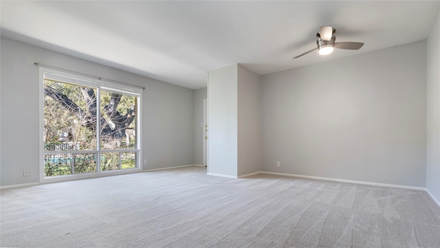 empty room with light carpet and ceiling fan