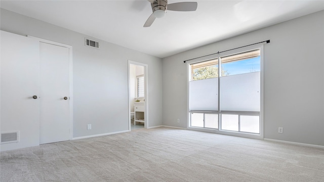 unfurnished room with light carpet and ceiling fan