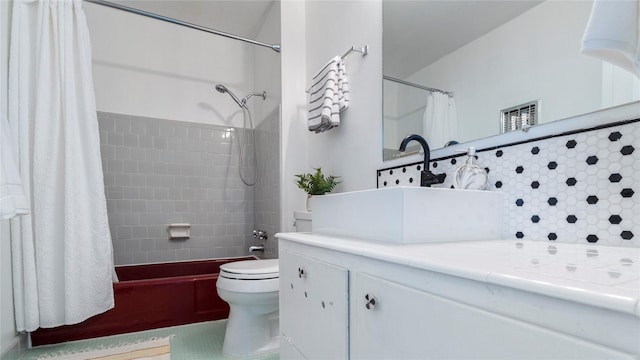 full bathroom featuring toilet, vanity, and shower / tub combo