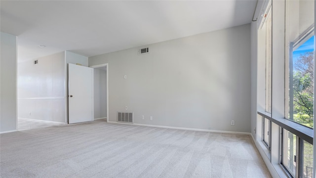 empty room with light colored carpet