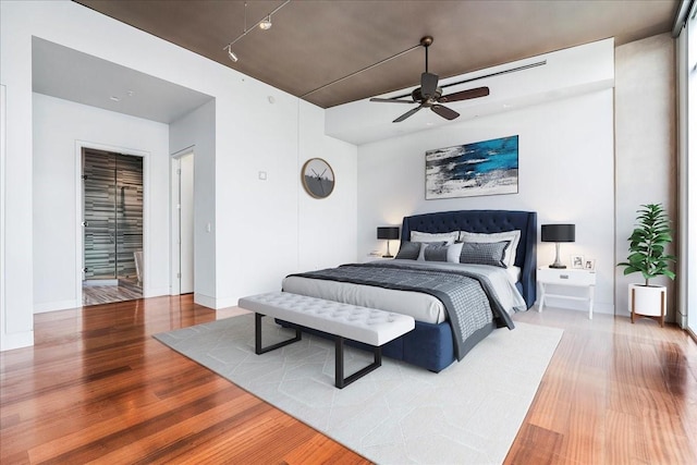 bedroom featuring ceiling fan and wood-type flooring