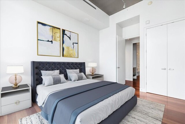 360 Nueces St Unit 4305, Austin, TX 78701 - bedroom with wood finished floors and a closet