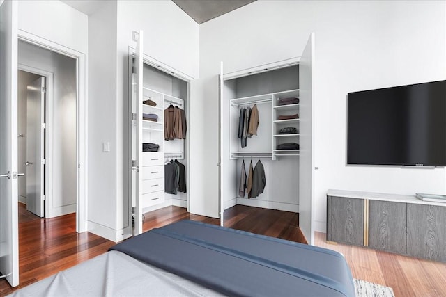 bedroom with hardwood / wood-style flooring and a closet