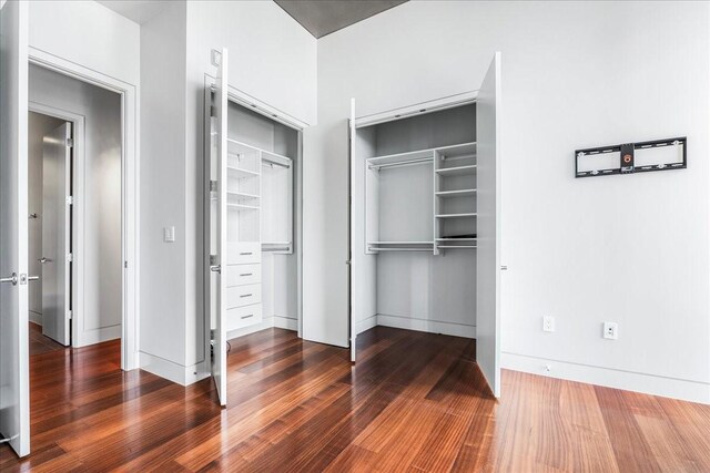 interior space with a closet and dark hardwood / wood-style floors