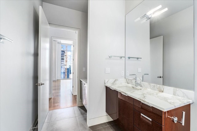 bathroom with tile patterned floors and vanity