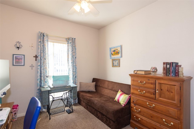 sitting room with ceiling fan and carpet floors