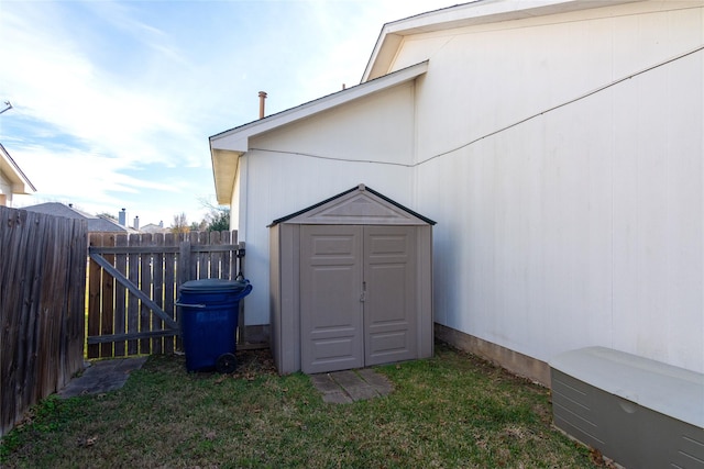 view of outbuilding with a lawn