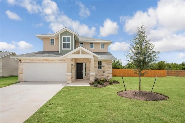 view of front of house featuring a front yard and a garage