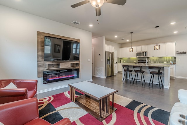 living room with ceiling fan