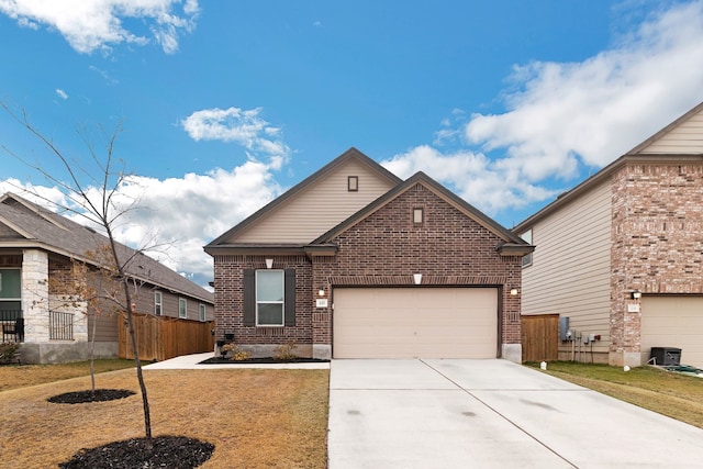 view of front of house with a garage and a front yard