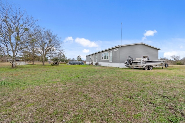 view of yard with central AC