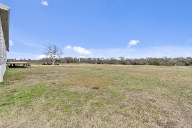 view of yard with a rural view