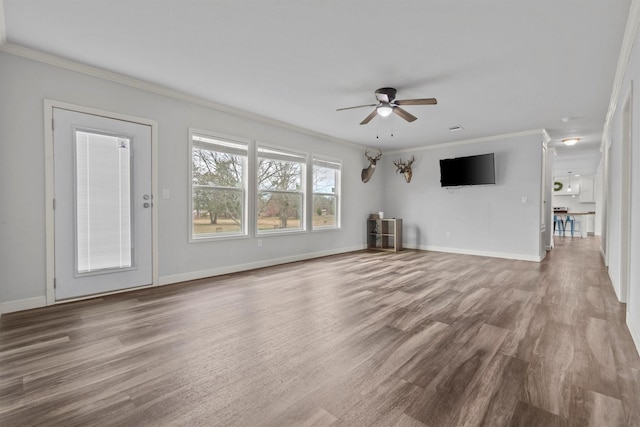 unfurnished living room with ceiling fan, wood-type flooring, and crown molding