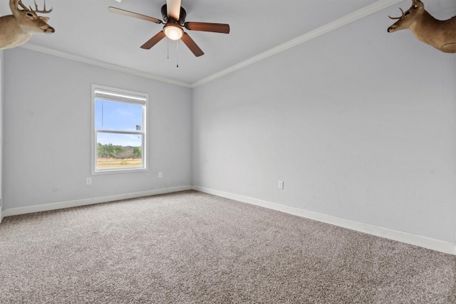 carpeted empty room with ceiling fan and ornamental molding