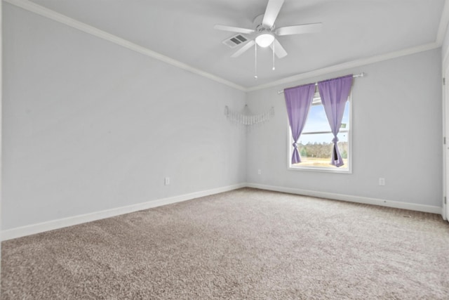 carpeted empty room with ceiling fan and ornamental molding