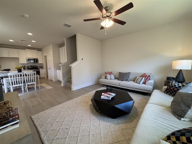 living room featuring ceiling fan