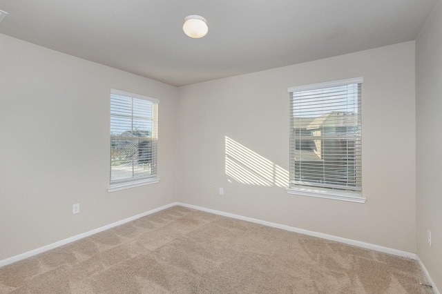 empty room with light colored carpet