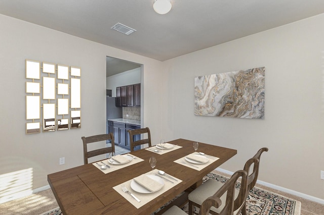 dining area with carpet floors