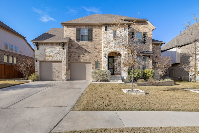 view of front of home featuring a front lawn and a garage