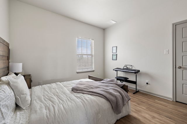 bedroom with light wood-type flooring