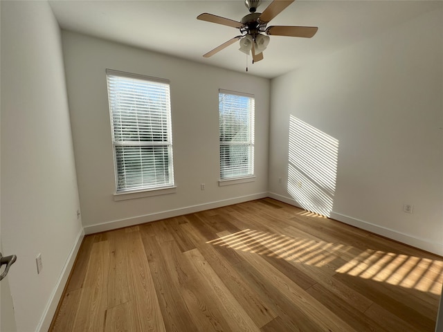 unfurnished room with ceiling fan and light hardwood / wood-style flooring