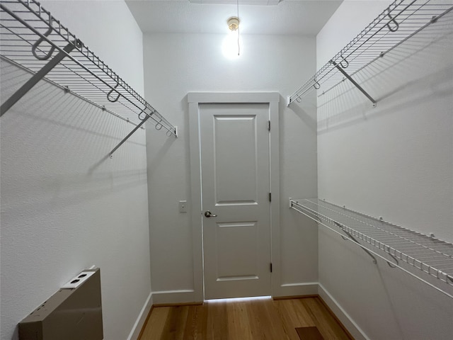 walk in closet featuring hardwood / wood-style floors