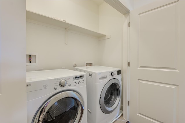 washroom with separate washer and dryer