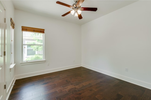 spare room featuring ceiling fan and dark wood-type flooring