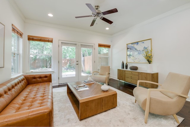 living room featuring a healthy amount of sunlight, wood-type flooring, french doors, and ceiling fan