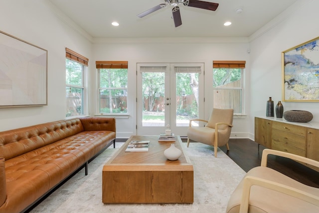 living room featuring ceiling fan, french doors, crown molding, and light hardwood / wood-style flooring