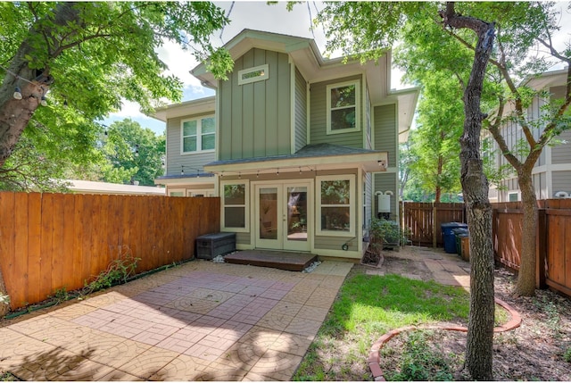 back of property featuring a patio area and french doors