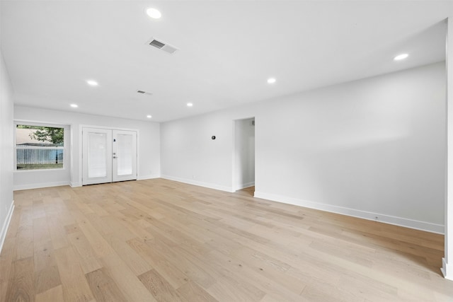 unfurnished living room with light hardwood / wood-style flooring