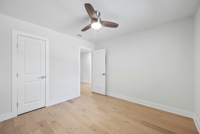 unfurnished bedroom featuring ceiling fan and light hardwood / wood-style floors