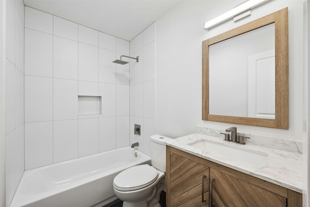 full bathroom with tiled shower / bath combo, vanity, and toilet