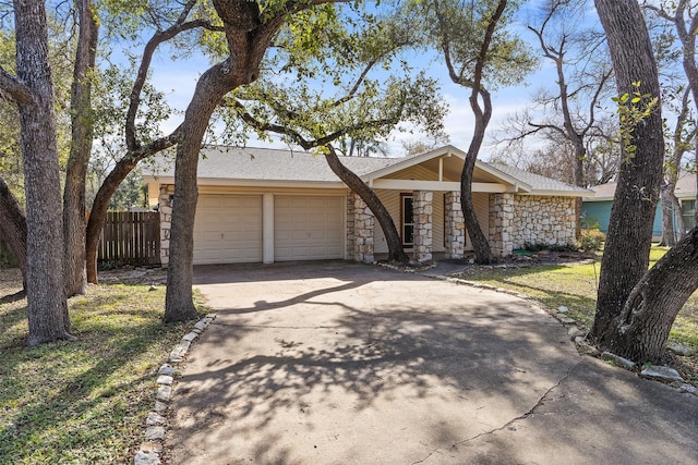 ranch-style home featuring a garage