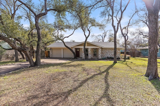 ranch-style house with a front yard and a garage