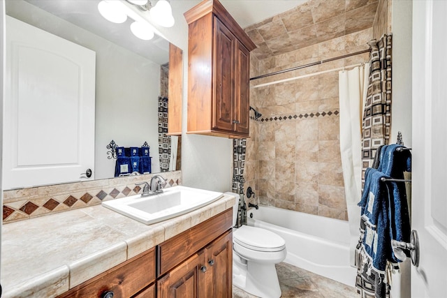 full bathroom featuring toilet, vanity, tile patterned floors, and shower / bath combination with curtain