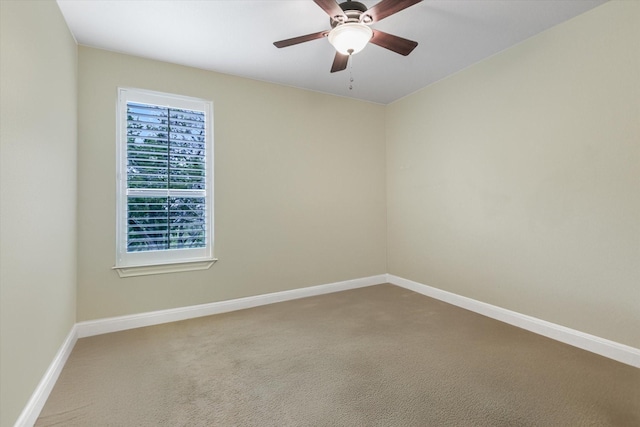 carpeted empty room with ceiling fan