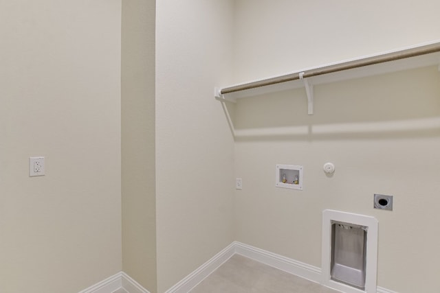 laundry room with electric dryer hookup, baseboards, gas dryer hookup, hookup for a washing machine, and laundry area