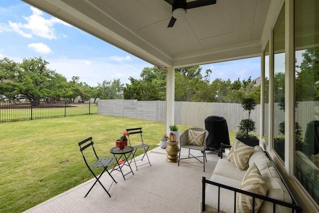 view of patio featuring ceiling fan and an outdoor living space