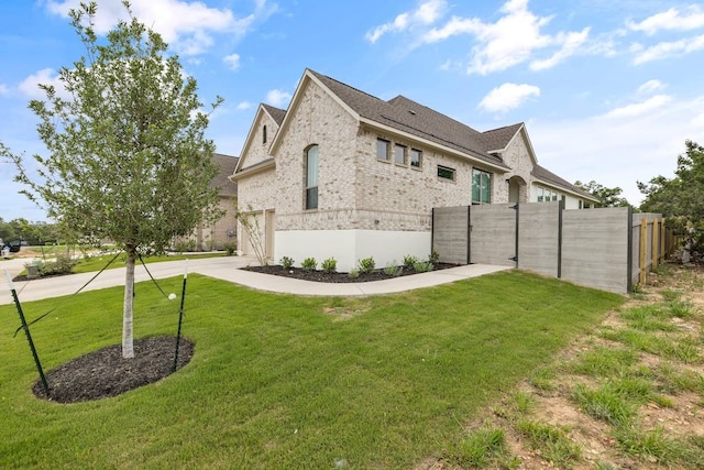 view of property exterior with a lawn