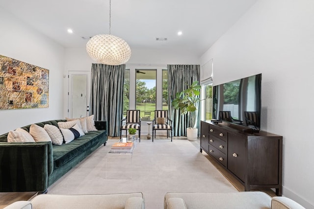 living room featuring a notable chandelier