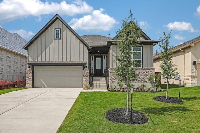 8412 Bouvreuil Dr, Austin, TX 78738 - view of front facade with board and batten siding, driveway, a front yard, brick siding, and a garage