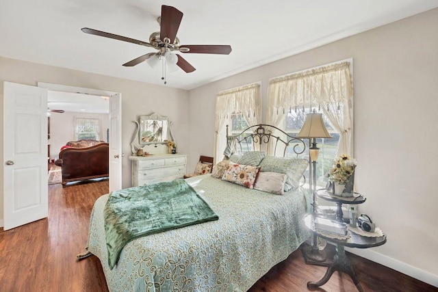 bedroom featuring ceiling fan and dark hardwood / wood-style flooring